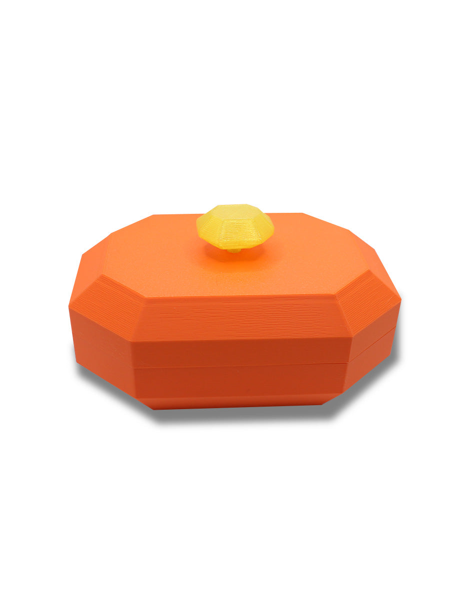joyero forma octagonal en color naranja y agarradera en forma octagonal amarillo con transparencia que simula una gema en foto vista de frente
